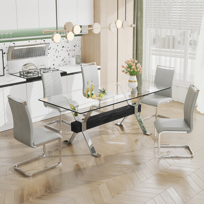 Modern tempered glass dining table with silver plated metal legs.