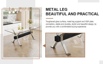 Modern tempered glass dining table with silver plated metal legs.