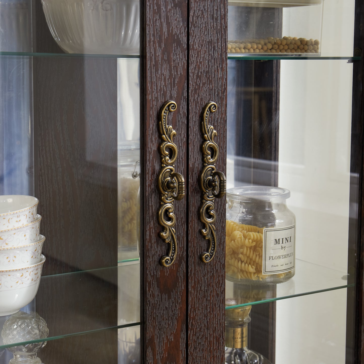 Double door wardrobe with tempered glass mirrored back panel.