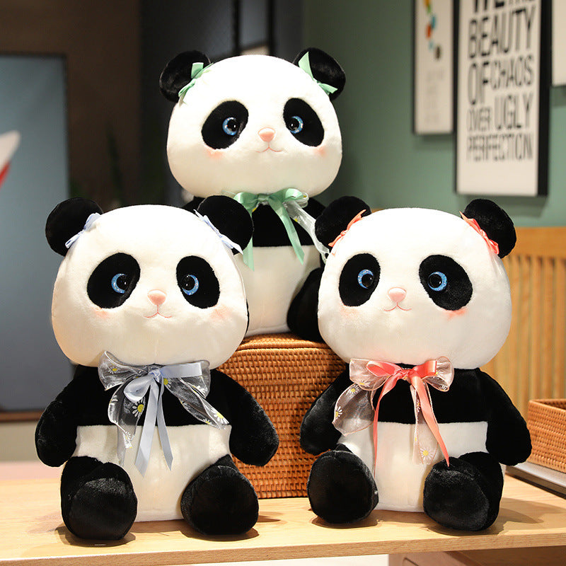 Panda plush toy with a cute bow.