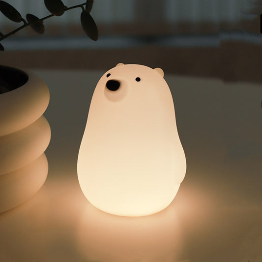 Small night light in the shape of a polar bear.