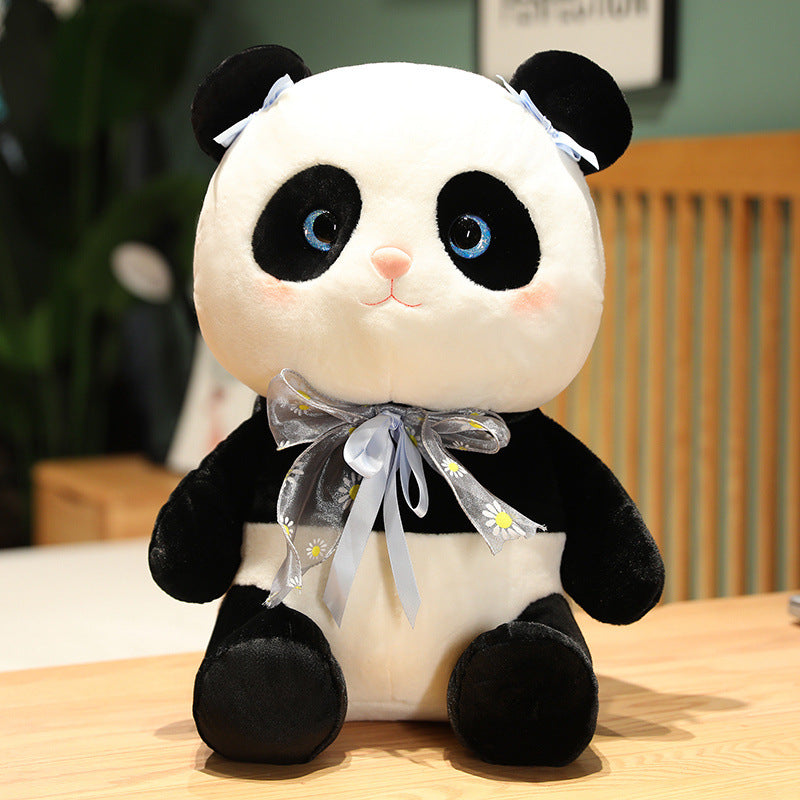 Panda plush toy with a cute bow.