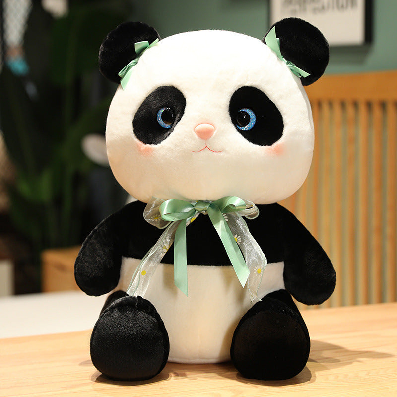 Peluche de panda avec un jolie noeux.